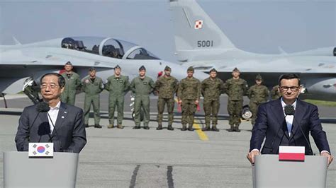 South Korean and Polish leaders visit airbase in eastern Poland and discuss defense and energy ties